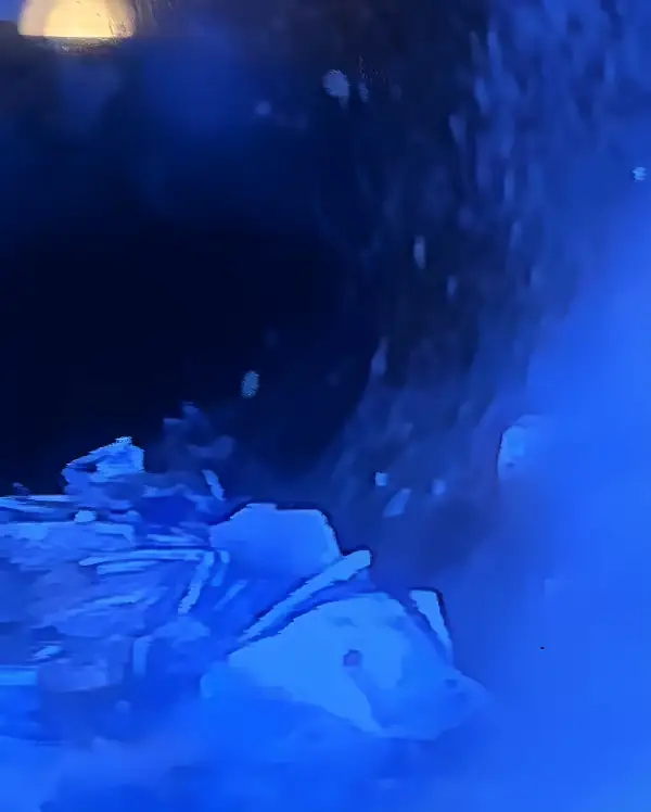 Drain camera monitor showing eggshells packed in a kitchen drain line.