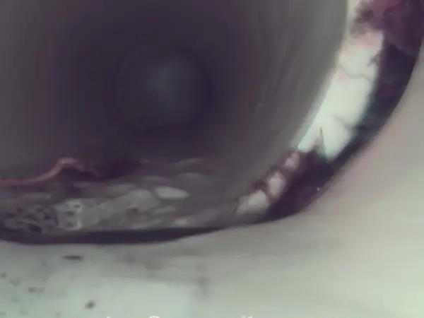 After: Sewer camera view of the same PVC line clear after jetting.