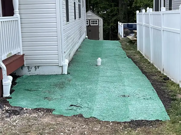 After: Finished side yard hydroseeded over the new sewer line.